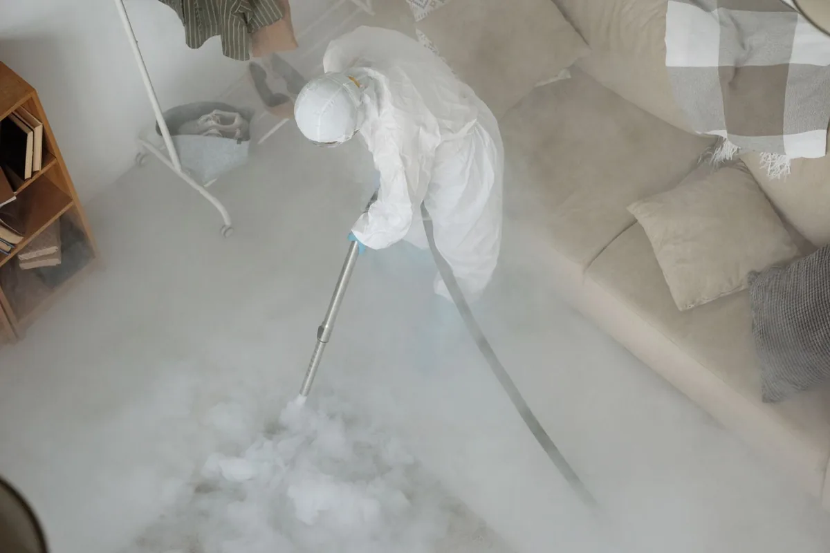 Biohazard cleanup technician in protective equipment, Edina, MN